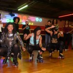 Black skaters rolling together in an urban skate rink, showcasing vibrant Black skate culture and community.