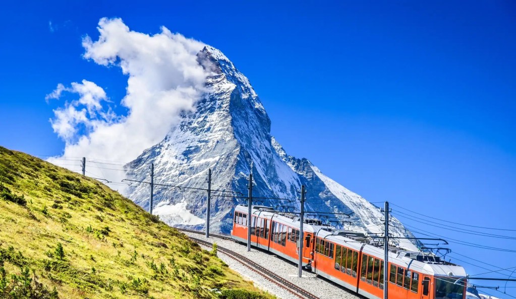 Scenic train journey in Switzerland with panoramic views of the Alps on the Glacier Express.