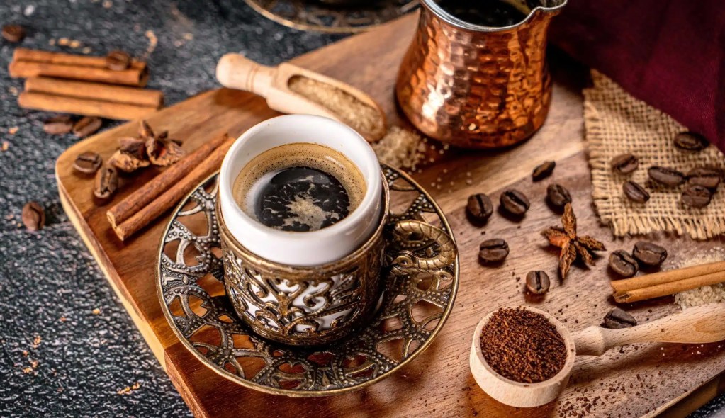 Traditional Turkish coffee culture in Istanbul with cezve pot and sweets